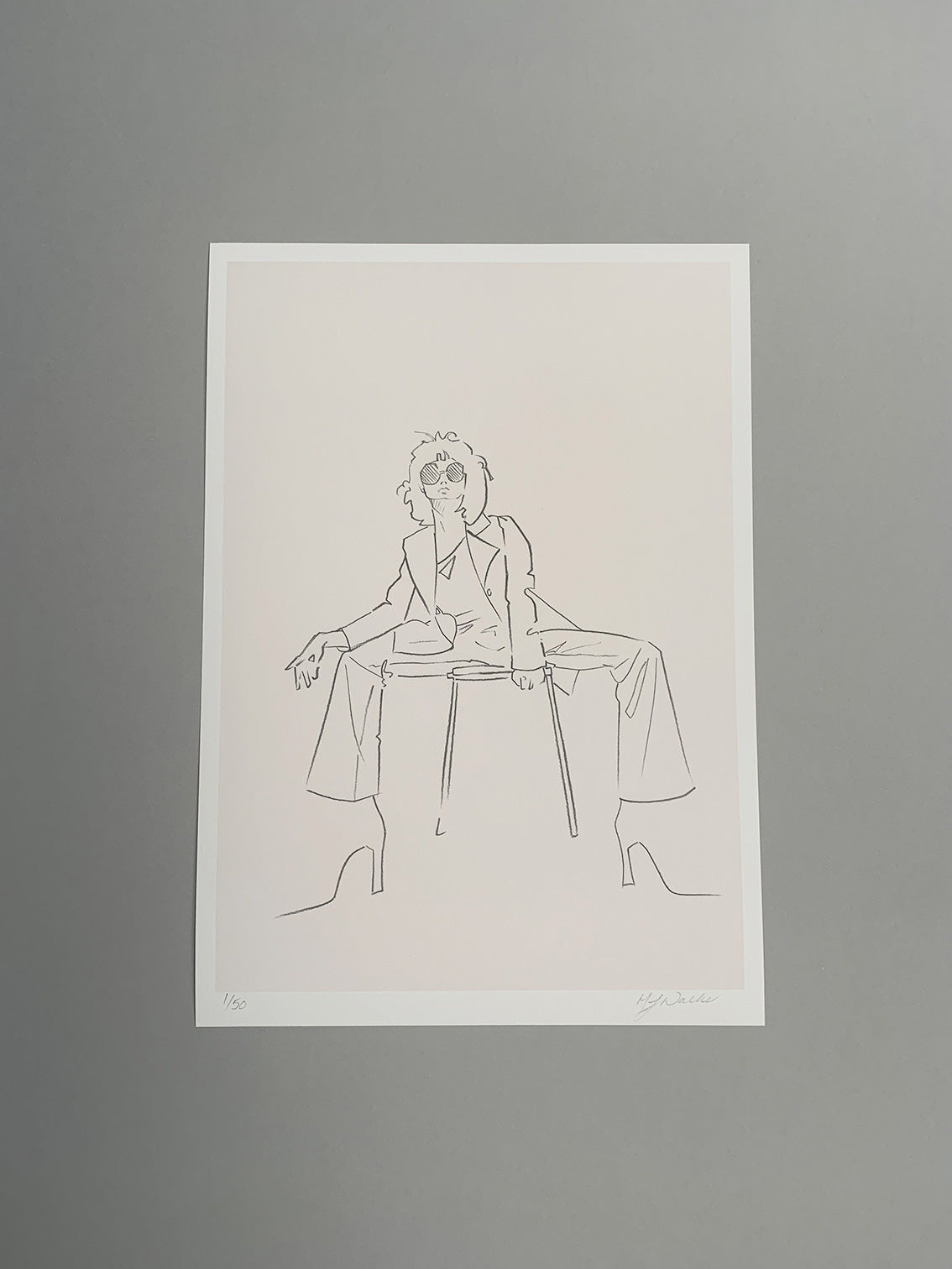 Charcoal sketch of a fashion model sitting on a stool on a grey background.