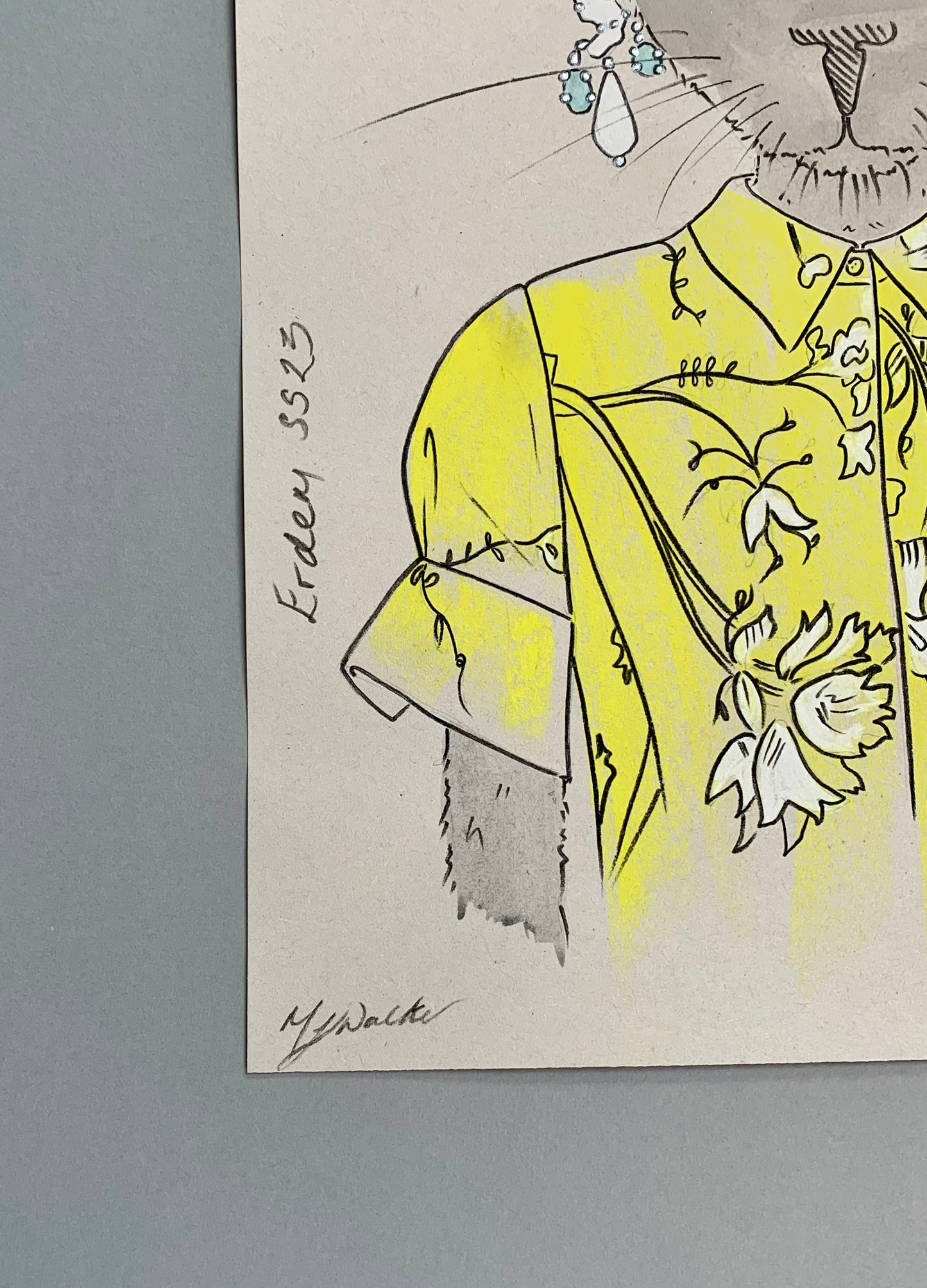 Details of a colourful illustration of a cat in designer Erdem clothing.