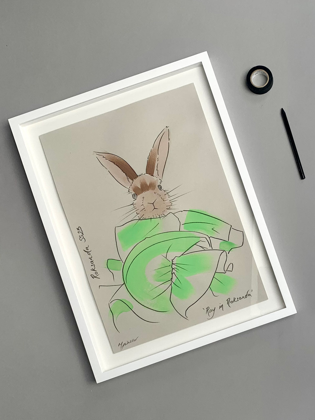 Colourful illustration of a bunny in designer Roksanda clothing on a grey background.