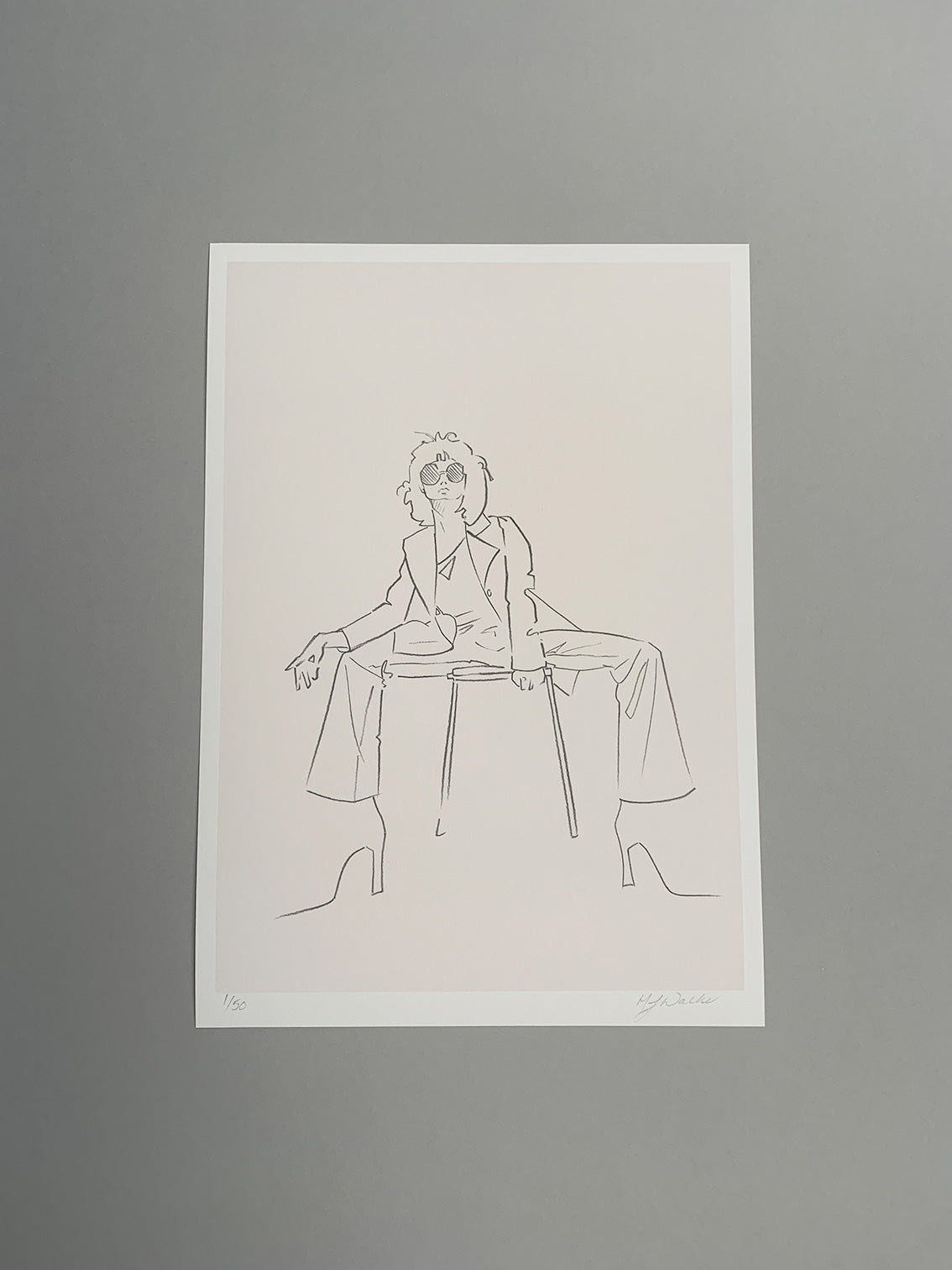 Charcoal sketch of a fashion model sitting on a stool on a grey background.