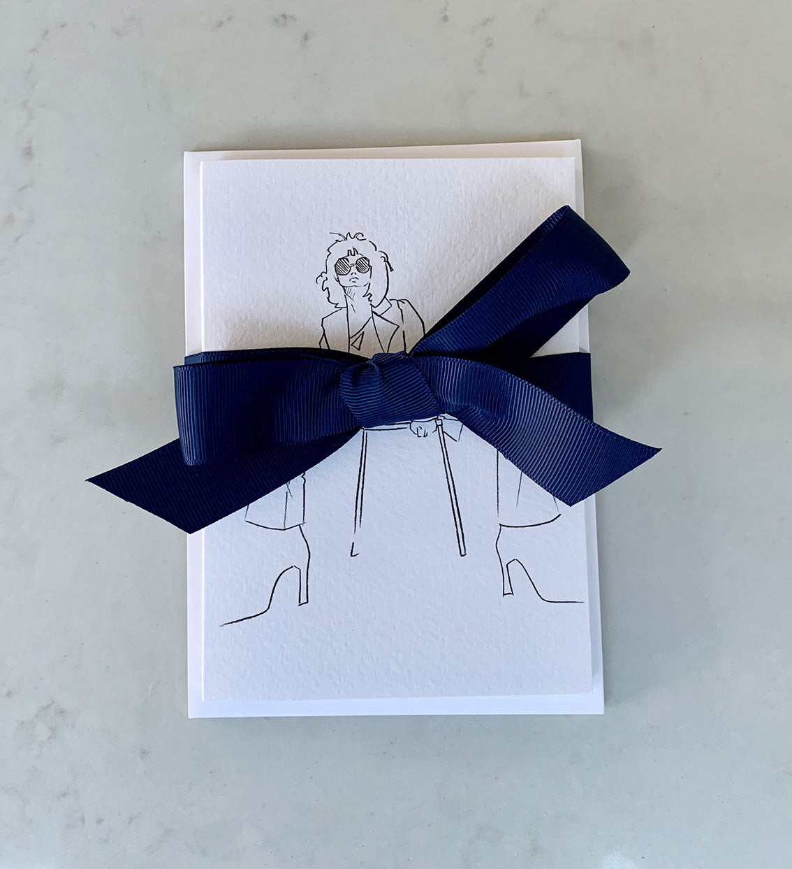 Set of 6 gift cards with fashion illustrations wrapped in a navy ribbon.
